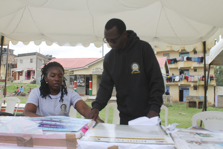 Court staffers display to the public information on court services during the Mavoko Law Courts Open Day in Mlolongo, Machakos County on April 26, 2024.