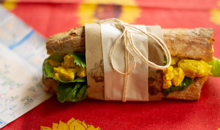 Coronation chicken with lettuce and parsley on butternut ciabatta.