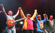 Guitarist  Cameron Ward and Hugh Masekela are joined by other artists to acknowledge the audience's applause. Picture credit: Antonio Muchave.