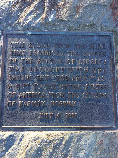 THIS STONE FROM THE MINE THAT PRODUCED THE COPPER IN THE STATUE OF LIBERTY WAS BROUGHT WITH THE SAILING SHIP "SORLANDET" AS A GIFT TO THE UNITED STATES OF AMERICAN FROM THE CITIZENS OF KARMOY,...