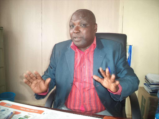Director Kisii University Baringo County campus Mr Joseph Kandie addressing media in his office on Tuesday. He appealed the Commission of University Education(CUE) to reverse the closure threats, saying he requries only six moths to refurbish the campus.PHOTO/JOSEPH KANGOGO