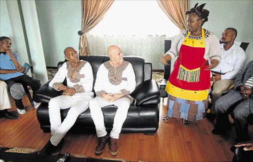 ROYAL SUPPORT: AbaThembu King Buyelekhaya Dalindyebo’s wife Queen Nokwanda Dalindyebo, right,addresses visitors Prince Tsiame Kenneth Mopeli, left,and Mark Driver, centre, during a meeting at Nkululekweni in Mthatha on Friday attended by leaders of the ‘free-our-king’ campaign Picture: LULAMILE FENI