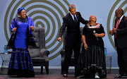 Nelson Mandela's widow Graça Machel, former US president Barack Obama, programme director Busi Mkhumbuzi, and President Cyril Ramaphosa dance on stage at the 16th Nelson Mandela Annual Lecture held at Wanderers Stadium in Johannesburg on July 17 2018.