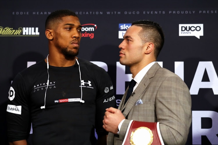Anthony Joshua (l) of Great Britain and Joseph Parker of New Zealand go head to head during a press conference at SKY Studios on March 27, 2018 in London, England.
