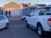 Special task force members at one of the properties raided in Parklands, Cape Town, on Tuesday.