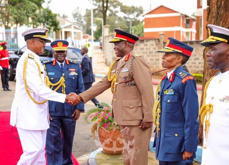 Chief of Defence Forces (CDF) General Charles Kahariri received by military members during a change of guard at the DoD in Nairobi on May 7, 2024.