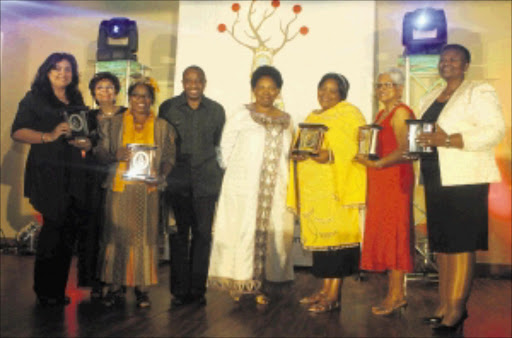 VICTORIOUS: Basic Education Minister Angie Motshekga (centre) and manager: nation building Victor Mecoamere (on her left) with winners of the Early Childhood Development Awards in Centurion on Thursday last week. 05/12/2009. © Sowetan.