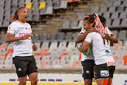 Rosko Specman of the Toyota Cheetahs celebrates with Malcolm Jaer and Clayton Blommetjies after scoring a try during the Super Rugby Unlocked match against the Vodacom Bulls in Bloemfontein on October 16, 2020. 