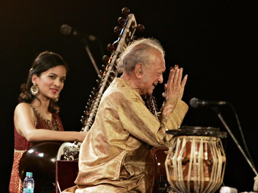 In this photograph taken on February 7, 2009, Indian sitar maestro Ravi Shankar (R) gestures while his daughter Anoushka Shankar (L, background) looks on during a performance at The Dover Lane Music Conference in Kolkata. According to reports on Indian television channels on December 12, 2012, Ravi Shankar has died aged 92 in San Diego, California.