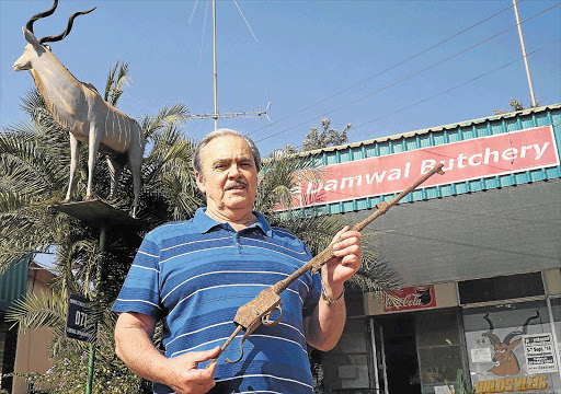 HISTORIC RELIC: Naas Hugo with what appears to be a rusted Martini-Henry rifle he picked up at Kanongat, Mpumalanga, years ago when the water level at the pool was extremely low Picture: CORINE DE JONGE/THE HERALD MIDDELBURG