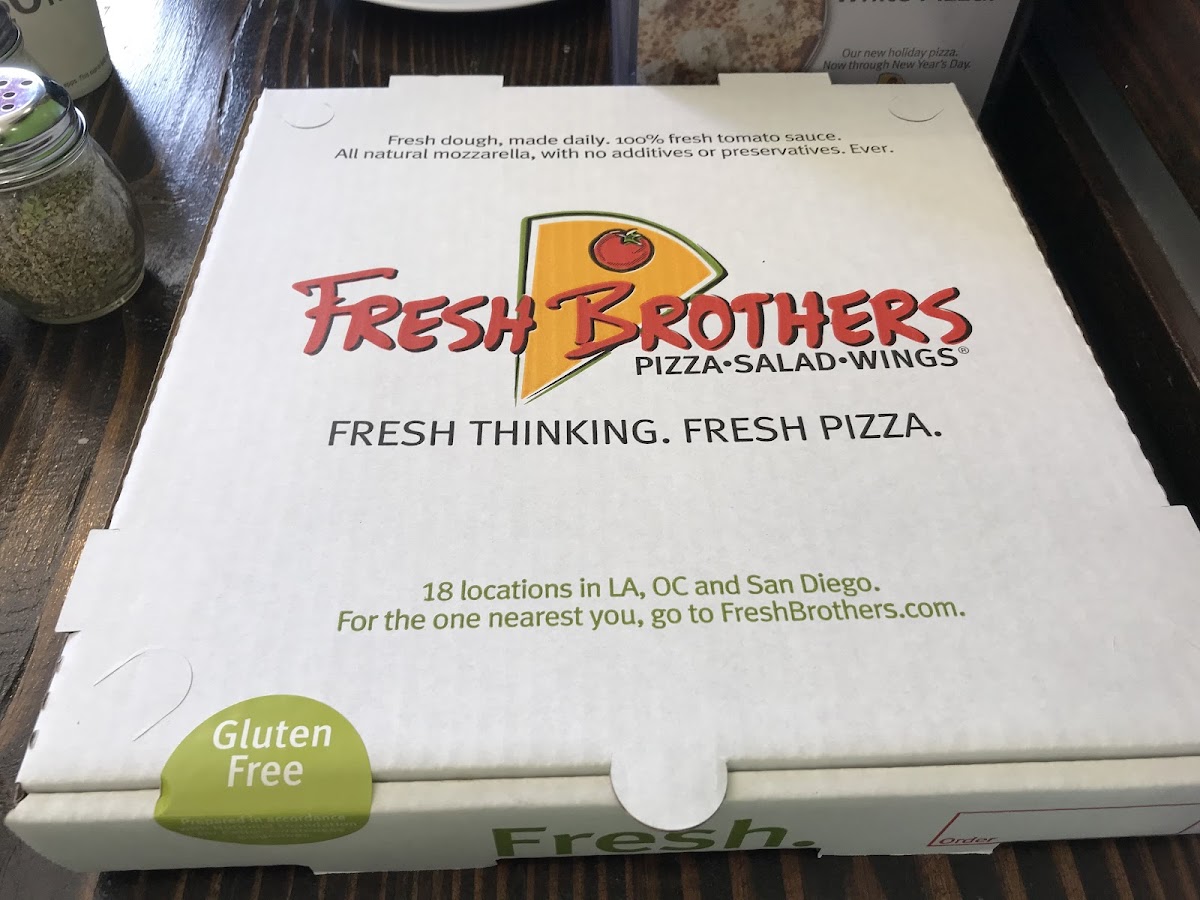 They not only prepare GF pizza separately, they put it in a box to prevent cross contamination. Yay!