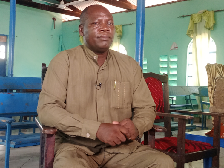 Reverend Joseph Mutunga of AIC church in Garissa during the interview inside the church.