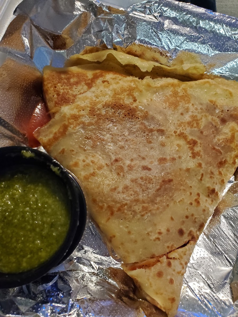 Gluten free pizza crepe with a side of pesto