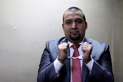 Former head of the Guatemalan Tax Administration Superintendency Juan Francisco Solorzano Foppa poses for a photo before entering a court hearing while being detained for alleged crimes including illicit association and conspiracy, in Guatemala City, Guatemala in this file picture.