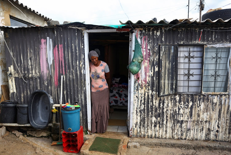 Dalene Raiters stands at the single room that she shares with her two sons and a grandchild in Eldorado Park, south of Johannesburg, ON March 28 2024. Picture: REUTERS/SIPHIWE SIBEKO