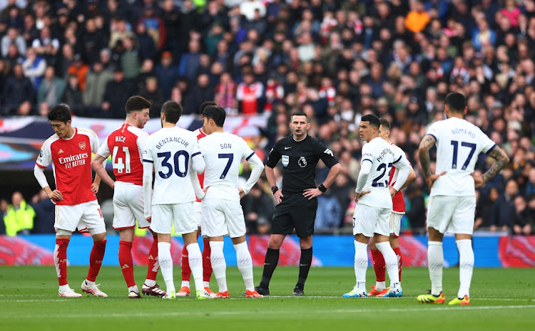 Referee Michael Oliver looks on as VAR checks, and later rules out a goal by Micky van de Ven of Tottenham Hotspur (not pictured) for offside during the Premier League match between Tottenham Hotspur and Arsenal FC at Tottenham Hotspur Stadium in London, England, April 28 2024. Picture: Clive Rose/Getty Images