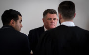 Murder accused Jason Rohde speaks with his defense team in court before day four begins. Picture: Anthony Molyneaux