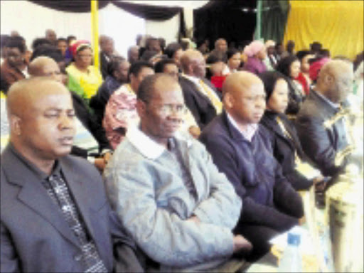 SADNESS: Thousands of mourners, including Limpopo Premier Cassel Mathale. third from left, attended the funeral of six people killed in an accident in Polokwane on June 18. Pic: Alex Matlala. 27/06/2009. © Sowetan.