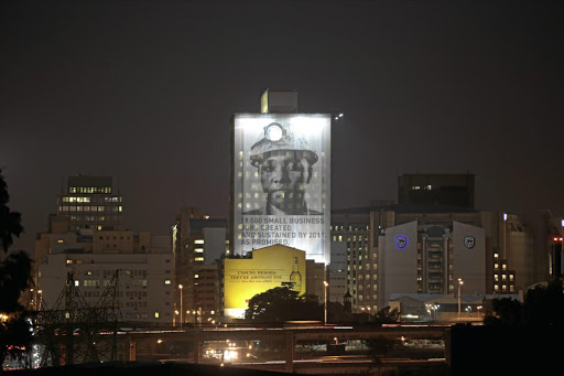 A photograph of a miner adorns the Anglo American building in Johannesburg. Anglo's shares have risen 138% over the past 12 months.