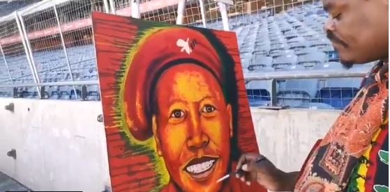 Rasta paints Julius Malema's portrait.