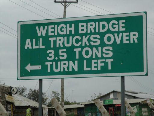 A file photo of a sign for motorists at Mariakani weighbridge. /ANDREW KASUKU