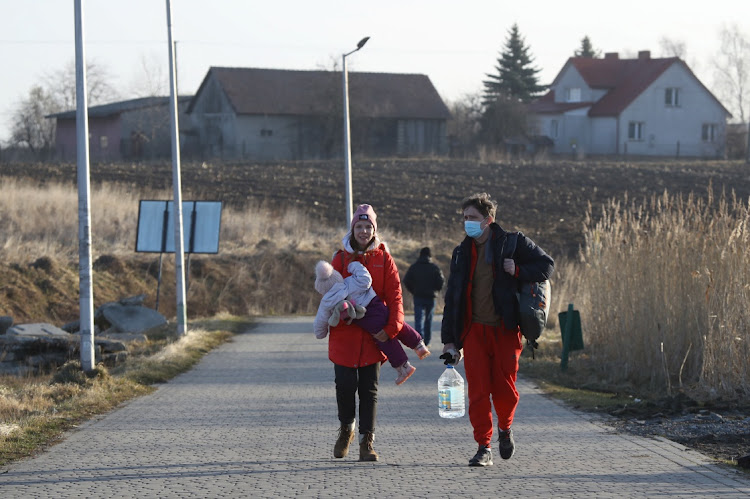 People at the border crossing between Poland and Ukraine, after Russian President Vladimir Putin authorised a military operation in eastern Ukraine, in Medyka, Poland, on February 24 2022.