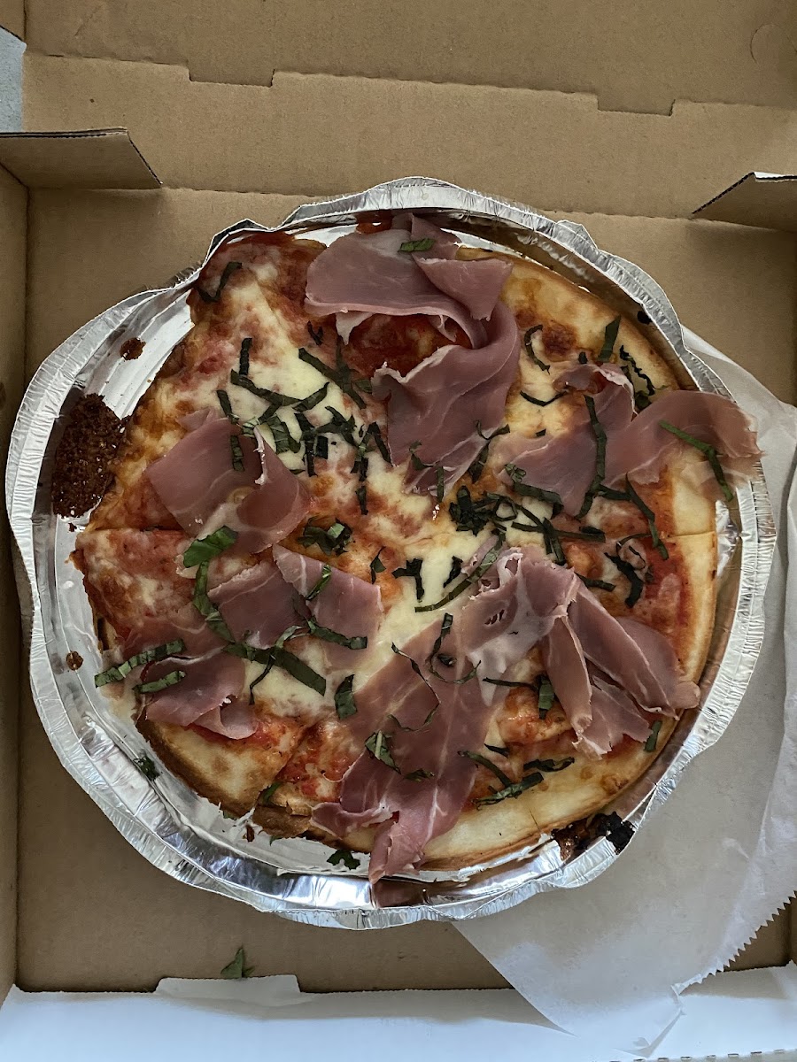 Prosciutto and basil pizza