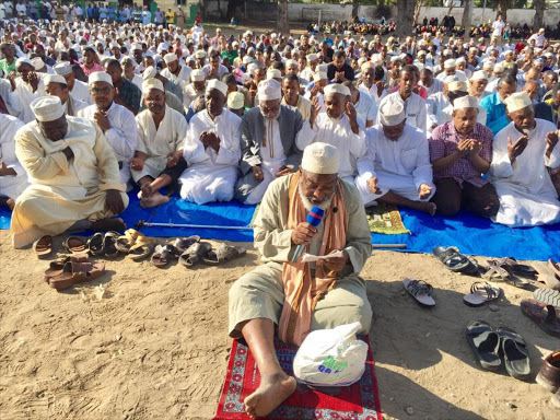 Sheikh Mohamed Dumila leads Muslim faithful in morning prayers at Makadara open grounds over hunger which has ravaged most parts of the Country./ELKANA JACOB