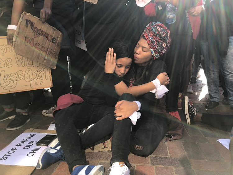 #TotalShutdown participants, Dorcas Naudé, 19, and Siphesihle Lugaju, 21, share a special moment following the march in Port Elizabeth on August 1, 2018.