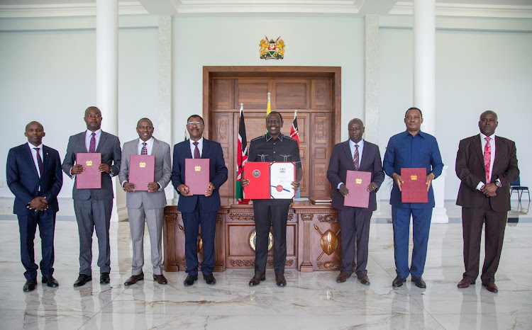 President William Ruto poses for photo with his deputy Rigathi Gachagua and other leaders after signing the Statute Law (Miscellaneous Amendments) Bill into law on April 24, 2024.