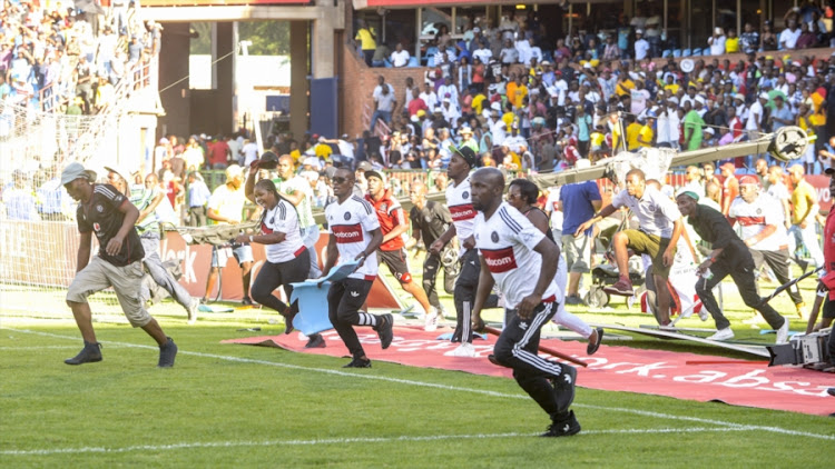 Orlando Pirates supporters on the rampage during the Absa Premiership match against Mamelodi Sundowns at Loftus Versfeld Stadium on February 11, 2017 in Pretoria, South Africa.
