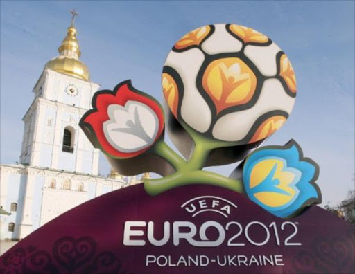 The logo of the UEFA EURO 2012 Cup seen in front of Mikhaylovsky cathedral in Kiev on 14 December 2009