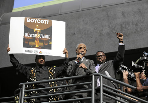 The Reverend Al Sharpton, right, speaks about the lack of diversity among the nominees at the 2016 Academy Awards at a rally before the awards.