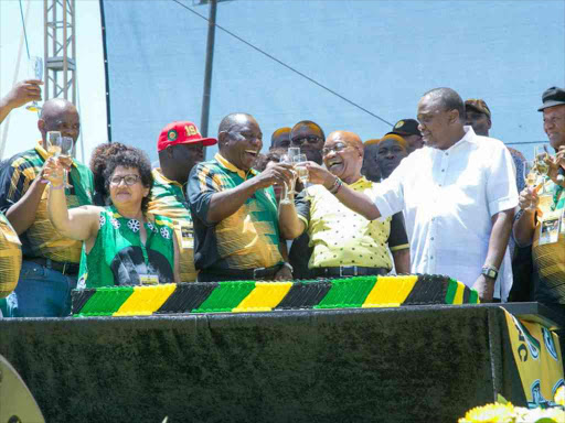 ANC president and South African deputy president Cyril Ramaphosa with President Jacob Zuma and Uhuru Kenyatta during the party's 106th anniversary celebrations at Buffalo City Stadium in the industrial town of East London, January 13, 2018. /PSCU