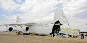 PAINFUL MISSION: Four mortuary trucks were among the vehicles loaded onto a cargo plane at Air Force Base Waterkloof in Pretoria on Friday Picture: DEPARTMENT OF COMMUNICATIONS