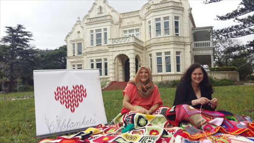 STITCH IN TIME: 67 Blankets ambassador Emily Bouwer and her daughter Bridgette Jarman will be knitting and crocheting for a giant pixelated blanket portrait of Nelson Mandelaat the Ann Bryant Art Gallery gardens on Saturday, November 19. Anyone can join in Picture: BARBARA HOLLANDS