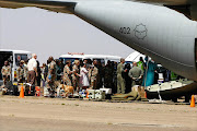 South African National Defence Force medical team assist survivors that were injured during the collapse of a building at the Synagogue Church of All Nations in Lagos, Nigeria. Picture Credit: Moeletsi Mabe. The Times