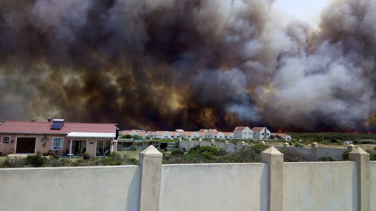 Fire threatens homes in the Overstrand on Friday January 11 2019. Evacuations were ordered in several suburbs.