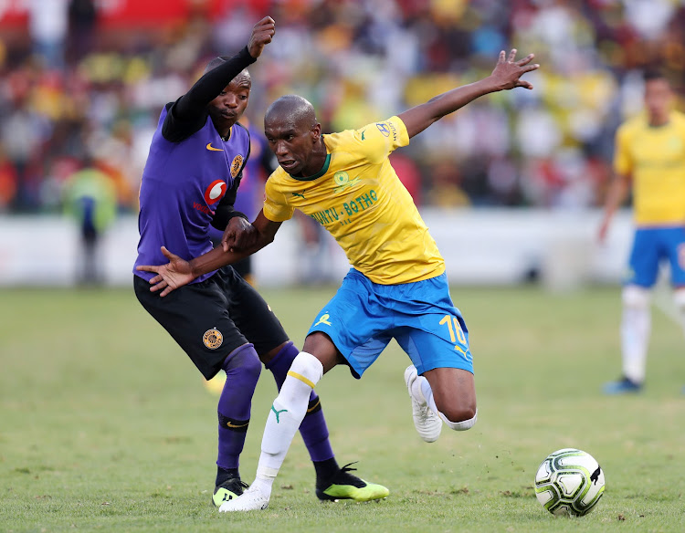 Anele Ngcongca (R) of Mamelodi Sundowns shields the ball away from Khama Billiat (L) of Kaizer Chiefs during the Absa Premiership match at Loftus Versveld Stadium in Pretoria on August 4 2018.