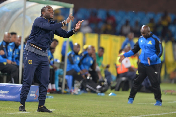 Cape Town City FC head coach Benni McCarthy reacts on the touchline next to his Mamelodi Sundowns counterpart Pitso Mosimane during the Absa Premiership match at Loftus Versfeld Stadium on December 19, 2017 in Pretoria, South Africa.