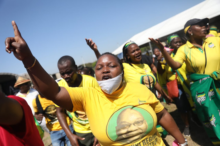 A supporter of former president Jacob Zuma with a T-shirt bearing his face during a prayer service at the People’s Park in Moses Mabhida Stadium in Durban.