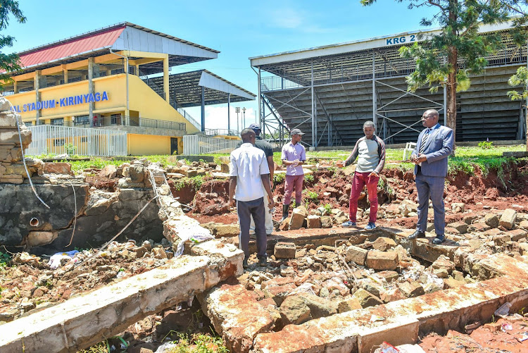 Kirinyaga County government officials assess a section of Wang’uru Stadium perimeter wall brought down by heavy rain, on April 18, 2024