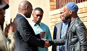 Minister Nathi Mthethwa with the family of the late Prokid, from left, Nhlanhla Mohlauli, Sbongile Besani and Nkululeko Vilakazi.  