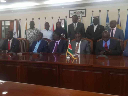 Officials of the Kenya National Union of Nurses, Council of Governors chairman Josphat Nanok and Health Cabinet Secretary Cleopa Mailu before the signing of a deal that ended the nurses' strike, November 2, 2017. /GILBERT KOECH