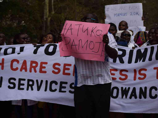 A section of health workers in Kwale County downed their tools on Tuesday and took to the streets demanding service allowances of Sh20, 000 and 15,000 respectively for various carders. / ALLOYS MUSYOKA