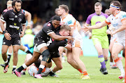 James Lang of Edinburgh tackles Ethan Hooker of the Hollywoodbets Sharks during the United Rugby Championship match in Durban on Saturday