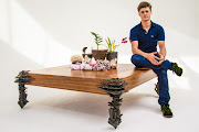 Artist Stanislaw Trzebinski sitting on “Triton’s Table”.