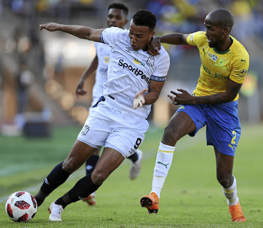 City's Matthew Rusike wards off the challenge by Mosa Lebusa of Sundowns during their MTN8 semifinal match at Lucas Moripe Stadium yesterday.