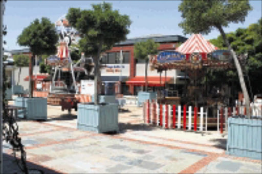 PLEASURE PARK: There is also fun in the sun and shade at the inside courtyard of Bellville Mall High Street shopping village. 14/01/2009. Pic. Ambrose Peters. © Unknown.