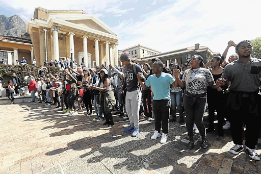 CHAIN REACTION: UCT students march past Jameson Hall on the upper campus. File photo.